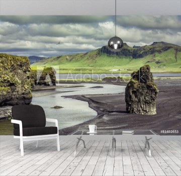 Picture of The black sand beach with typical Icelandic mountain landscapes